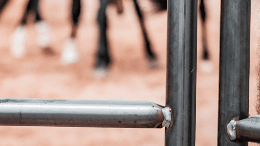 Rust on steel post and rail fencing